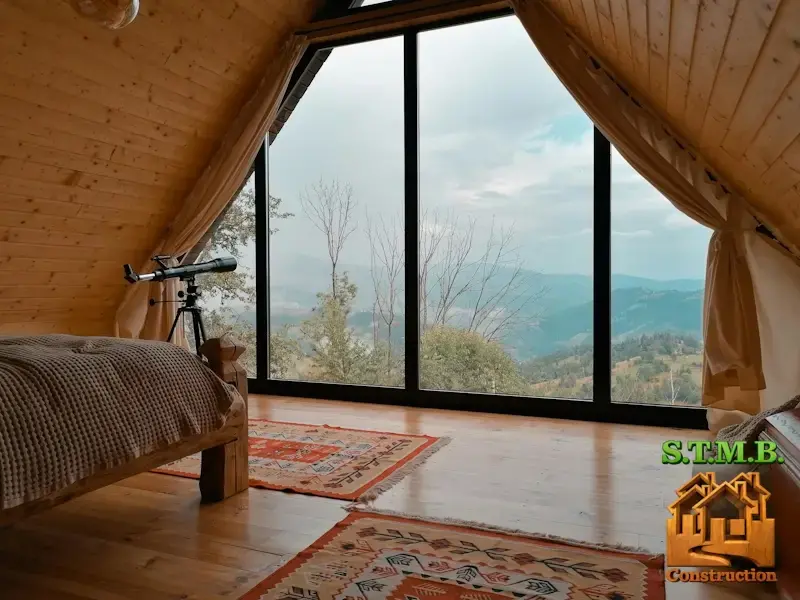 Interieur chalet en bois chambre cosy avec fenetre panoramique